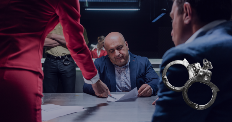 A Lawyer checking the criminal records provided the personal standing in-front of him and another seated opposite to him